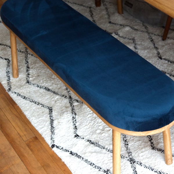 Solid European Oak Bench with rounded end straight turned legs with a fixed padded cushion that is upholstered in a recycled velvet fabric