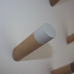 Large Diameter Peg hooks with concealed fixings and hand painted tips available in a range of timber, colours and finishes