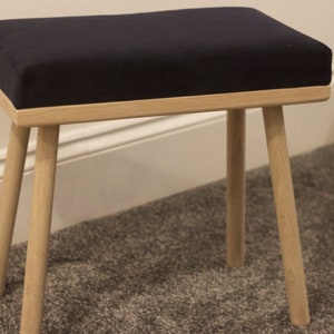 Rectangular Oak Footstool with four straight turned legs upholstered in a soft luxury velvet fabric and finished in danish oil