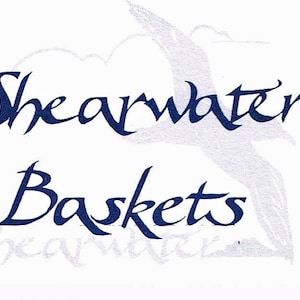 May include: A white background with a blue cursive logo that reads "Shearwater Baskets" with a stylized seagull image above the text.