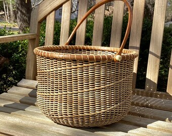 12-inch round Nantucket-style basket with stained ebony staves and spiral pattern