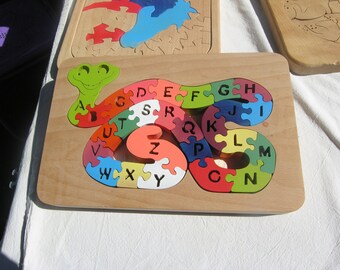 Wooden puzzle, snake in alphabet handmade and local