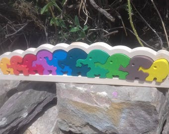 Wooden puzzle of 10 elephants