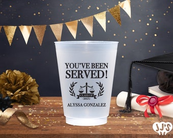 May include: A clear plastic cup with the text "You've Been Served!" and a black and white illustration of a scale of justice with a banner that reads "Class of 202X" and the name "Alyssa Gonzalez".