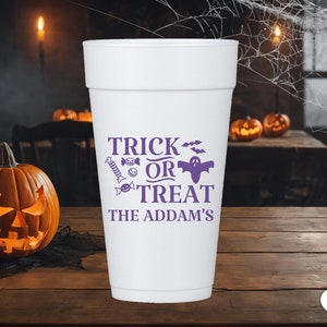 May include: White foam cup with a purple design that says "Trick or Treat The Addams". The design includes a ghost, bats, and candy.