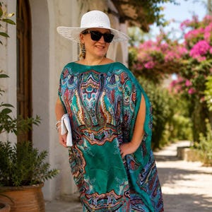 Aquamarine silk georgette kaftan dress in a tropical resort, plus size wedding guest dress, luxury resort wear, cruise outfit and designer paisley beach cover up.