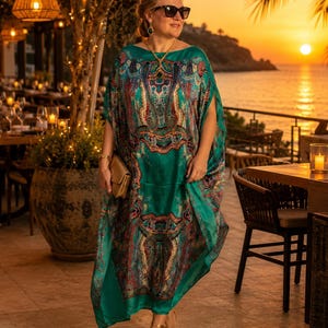 Aquamarine silk kaftan styled for sunset dining by the ocean, wedding guest dress, luxury resort wear and cruise evening outfit.