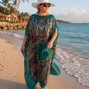 Flowing aquamarine silk georgette kaftan on the beach, designer paisley maxi kaftan dress for resort wear, cruise holidays and summer vacations.