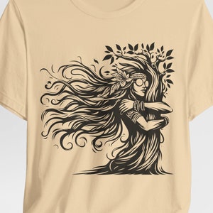 May include: A beige t-shirt featuring a black and white graphic print of a woman with long hair embracing a tree. The woman is wearing a headband and sunglasses.