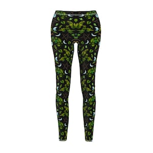 May include: Black leggings with a green and white pattern of leaves, moons, and pentagrams.