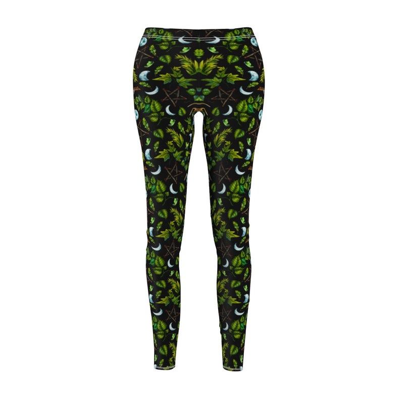 May include: Black leggings with a green and white pattern of leaves, moons, and pentagrams.
