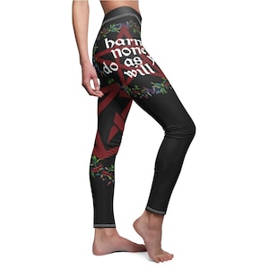 May include: Black leggings with a red pentagram and floral design. The pentagram has the text "harm none as you will" written on it.
