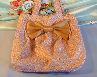 Pink and gold pleated bag