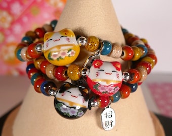 Bracelet de perles en porcelaine élastique chat porte-bonheur japonais maneki-neko couleur au choix rouge jaune noir rose orange bleu, Noël