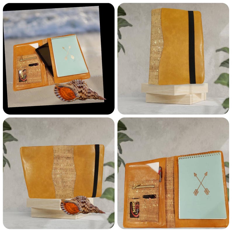 May include: A tan leather notebook with a cork accent and black elastic closure. The notebook is open, revealing a light blue notepad with an arrow design. A seashell is next to the notebook.
