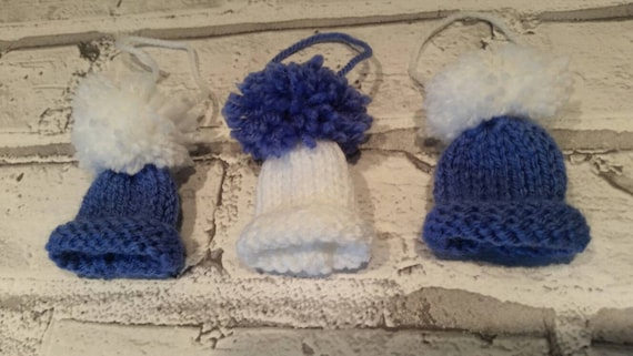 blue and white bobble hat