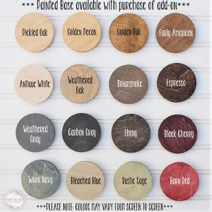 May include: A chart of 16 different wood stain colors, including Pickled Oak, Golden Pecan, Golden Oak, Early American, Antique White, Weathered Oak, Briarsmoke, Espresso, Weathered Gray, Carbon Gray, Ebony, Black Cherry, Worn Navy, Bleached Blue, Rustic Sage, and Barn Red. The text "PLEASE NOTE: COLORS MAY VARY FROM SCREEN TO SCREEN" is at the bottom of the chart.