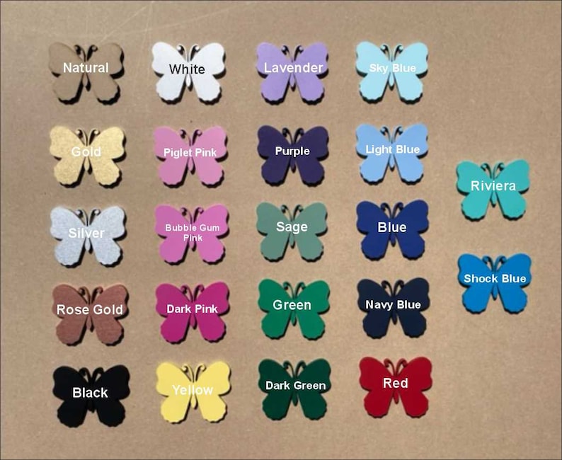 May include: A collection of butterfly-shaped cutouts in various colors, including natural, white, lavender, sky blue, gold, piglet pink, purple, light blue, silver, bubble gum pink, sage, blue, rose gold, dark pink, green, navy blue, black, yellow, dark green, and red. Each butterfly has a color label.