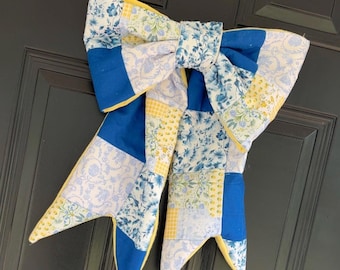 Ręcznie robiona pikowana kokarda patchworkowa