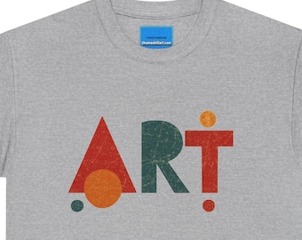 May include: A heather gray short-sleeve t-shirt featuring the word ART printed in a distressed, geometric style. The letter A is a red triangle, the R is dark green, and the T is red with a small orange circle above it and a red dot below.