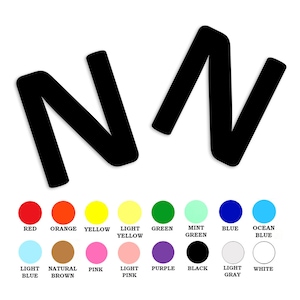 May include: Black and white graphic of the letters "NV" in a stylized font. The letters are in a diagonal position, with the "N" on the left and the "V" on the right. The image is surrounded by a color palette of red, orange, yellow, light yellow, green, mint green, blue, ocean blue, light blue, natural brown, pink, light pink, purple, black, light gray, and white.