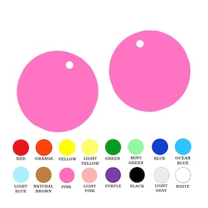May include: Two pink circles with a small hole in the center. The circles are on a white background. Below the circles are 16 smaller circles in various colors, including red, orange, yellow, green, blue, purple, black, white, light blue, light yellow, light pink, and light gray. Each circle has a label underneath it with the color name.