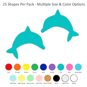 May include: Two teal dolphin-shaped cutouts positioned above a color chart displaying 17 distinct color options with labels including Red, Orange, Yellow, Green, Blue, Purple, Teal, Pink, Ocean Blue, Light Blue, Light Yellow, Mint Green, Light Pink, Brown/Kraft, Black, Light Gray, and White. The text 25 Shapes Per Pack - Multiple Size & Color Options is at the top.