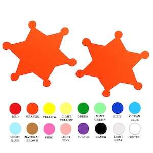 May include: Two orange five-pointed star shapes with rounded edges. The stars are on a white background. Below the stars are color swatches in red, orange, yellow, light yellow, green, mint green, blue, ocean blue, light blue, natural brown, pink, light pink, purple, black, light gray, and white.