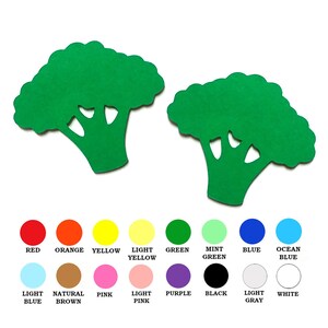 May include: Two green felt broccoli shapes on a white background. The shapes are cut out and have a simple design. Below the shapes are 12 colored circles with the names of the colors written below each circle.