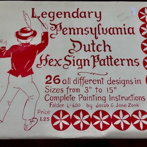 May include: A cream-colored paper with red text and illustrations. The text reads "Legendary Pennsylvania Dutch Hex Sign Patterns" and includes a drawing of a person in traditional attire. The paper includes 26 designs in sizes from 3" to 15".