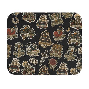 May include: Black mousepad featuring a repeating pattern of vintage tattoo-style illustrations. Designs include a motorcycle, a ship, a tiger, a dagger, a rose, a snake, and phrases like "No Regrets" and "Stay Wild."