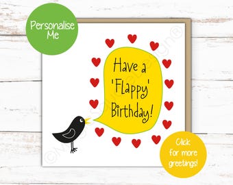 May include: A square greeting card featuring a black bird with a yellow beak facing a large yellow speech bubble. The bubble contains the black text Have a Flappy Birthday! surrounded by a circular pattern of small red hearts on a white background.