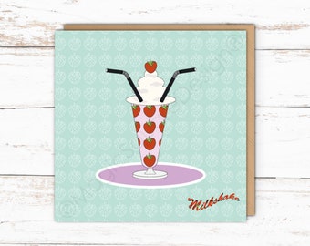 May include: A square greeting card featuring a tall glass filled with a pink strawberry milkshake, topped with whipped cream and a single strawberry. Two black straws are inserted into the glass. The word Milkshake is printed in red script.