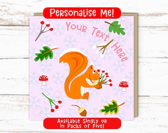 May include: A square greeting card featuring a central orange squirrel holding an acorn and berries. The light purple background displays a snowflake pattern, red mushrooms, green leaves, and berries. Text reads: Personalise Me!, Your Text Here, and Available Singly or in Packs of Five!