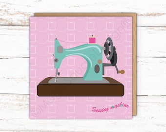 May include: A square greeting card featuring a teal vintage-style sewing machine with a pink spool of thread on top, set against a light pink background patterned with white thread spools. The text Sewing machine is printed in pink.
