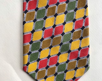 70's vintage textured colorful wide “bell” necktie, that features brightly colored small squares