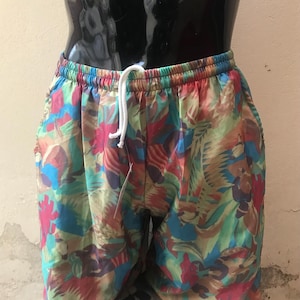 Fancy beach wear swim trunks for men, features pal colored brush styled prints, early 90s vintage, kitschy cute mens bath suit, found unworn
