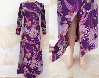 Fascinating 70&#39;s long violet/lilac dress with floral pattern and bold slit at the front and at sleeves