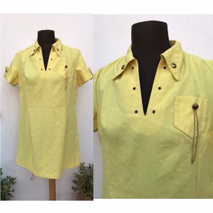 Lemon yellow mod 60s dress with pointed collars, V neckline, decorated with bronze buttons, chains & studs. Size M/L