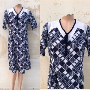 50&#39;s blue geometric tea dress, with white contrasting panel on the shoulders & blue braided trim on the neckline that ties