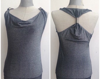 Glamorous silver/metallic draped neckline fitted blouse with impressive open back & metallic details