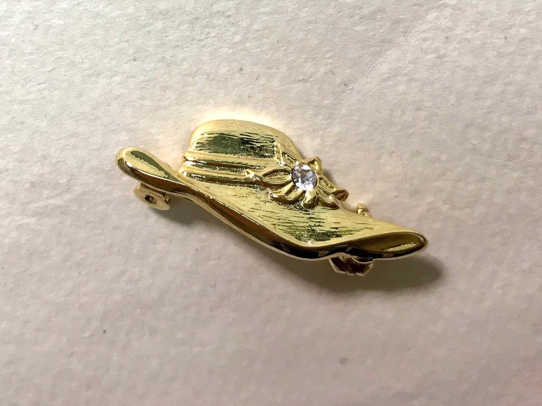 CHANEL - bijoux/broche logo métal doré -vintage année