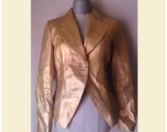 Metallic gold leather, waisted jacket, in tailcoat cut that closes with one button at the front, 90s vintage