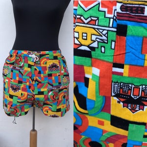 Colorful, fun 1980s kitschy cute all cotton shorts for men featuring vibrant abstract, geometric, ikat designs, with pockets, made in Greece