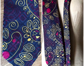 Swirl floral printed novelty 70s vintage “bell” necktie in blue, green and fuchsia, made in Greece