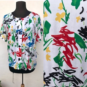 Abstract, artsy 1980s buttoned shirt that features colorful artistic pattern, very typical 80s prints by Divina of Switzerland