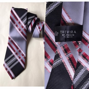 Wide 70s groovy, Trevira, “bell” necktie features nova check designs in old school style