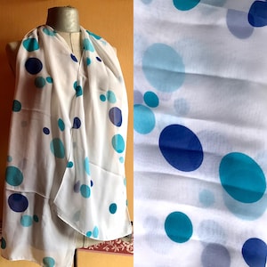 Dotty 90s vintage long, sheer scarf features turquoise, dark blue circles on the white canvas