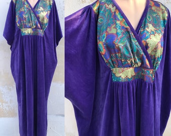 Long purple velvet 1970s vintage caftan features satiny floral bust, batwing sleeves, inner waist cords. One size fits all