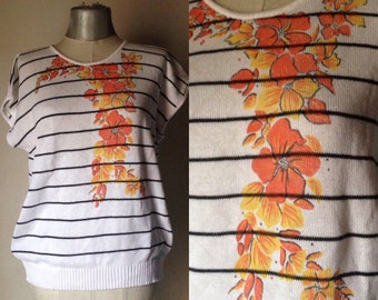 70s vintage white knit top with short sleeves, black stripes and orange floral prints